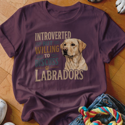 Maroon t-shirt with text "Introverted but willing to discuss Labradors" and dog image.