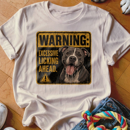 White t-shirt with a distressed graphic featuring a pitbull and the text "WARNING: EXCESSIVE LICKING AHEAD."