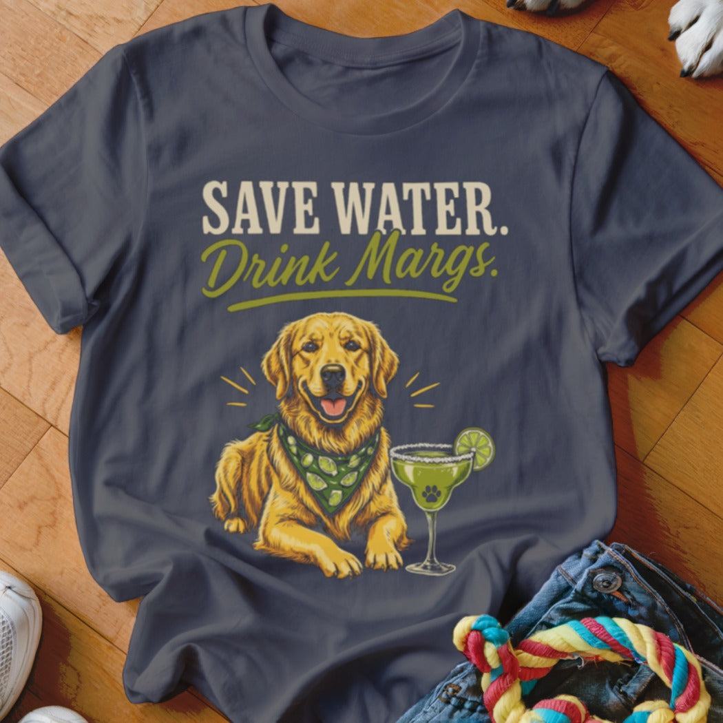 Dark gray t-shirt featuring a graphic of a golden retriever wearing a lime-patterned bandana next to a margarita with text reading Save Water Drink Margs.