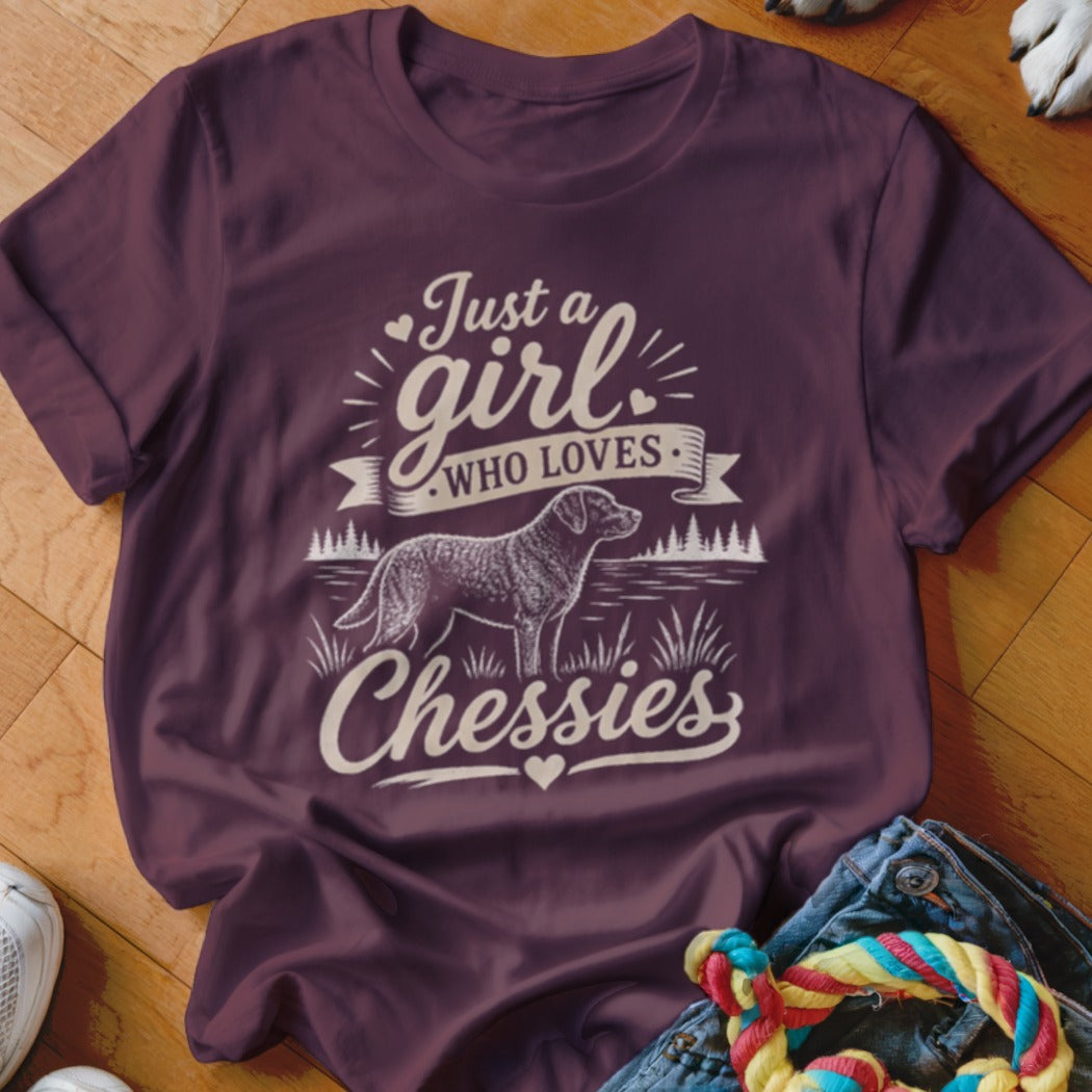 Maroon t-shirt with "Just a girl WHO LOVES Chessies" text and dog graphic.