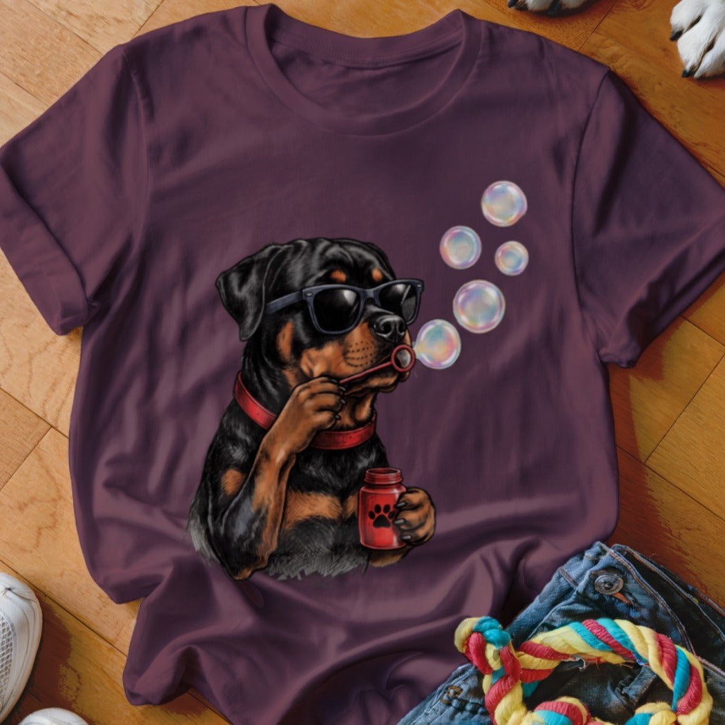 Maroon t-shirt featuring a graphic of a Rottweiler wearing sunglasses and blowing bubbles.