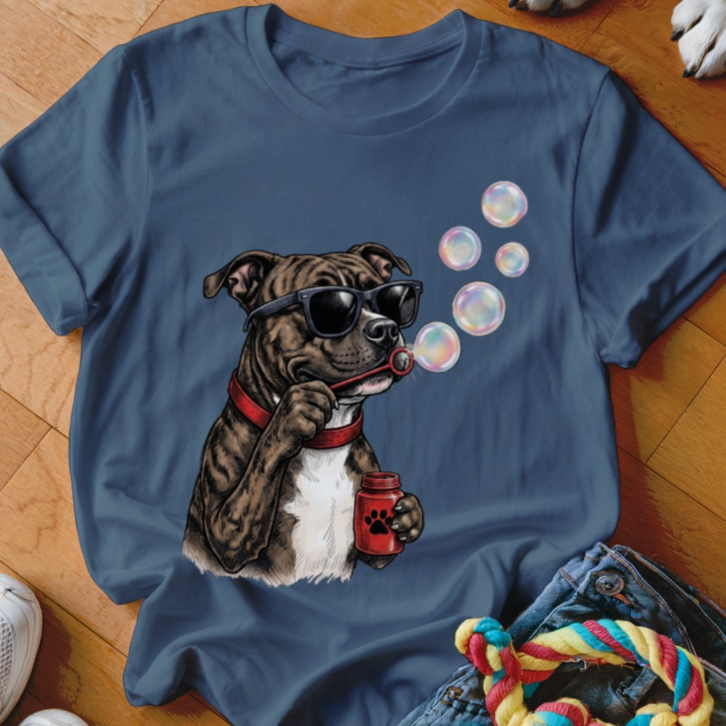 Blue t-shirt featuring a graphic of a brindle dog wearing sunglasses and blowing bubbles.