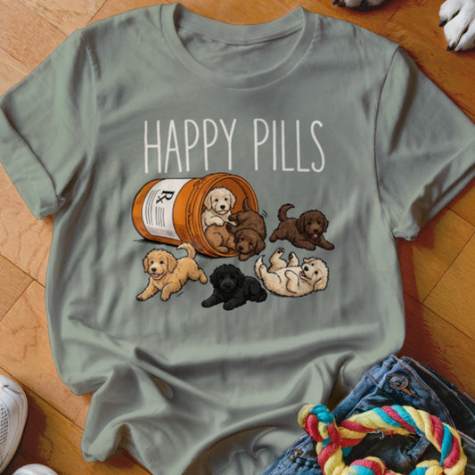 T-shirt with "HAPPY PILLS" text and cartoon puppies spilling from a pill bottle.