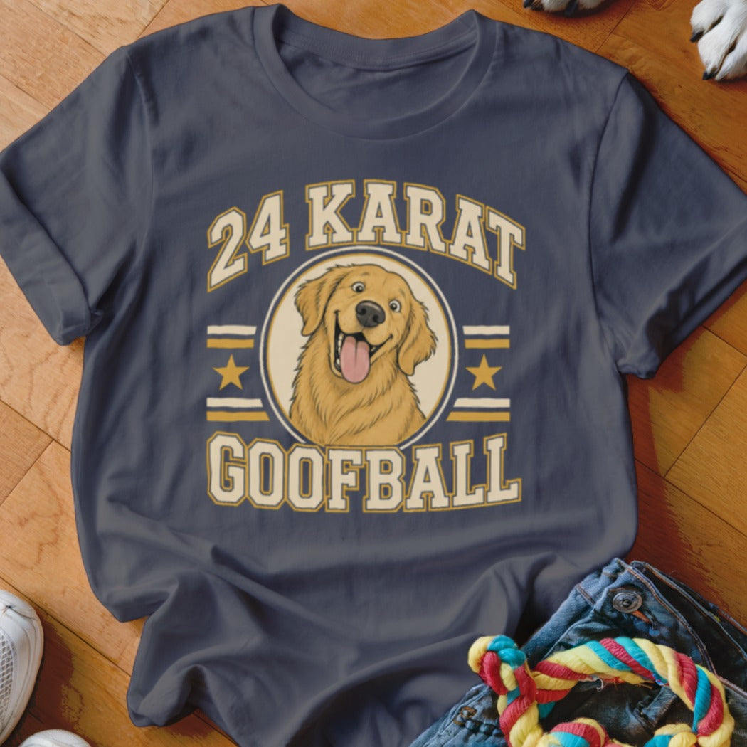 A dark gray t-shirt with a graphic of a golden retriever and the text 24 Karat Goofball.