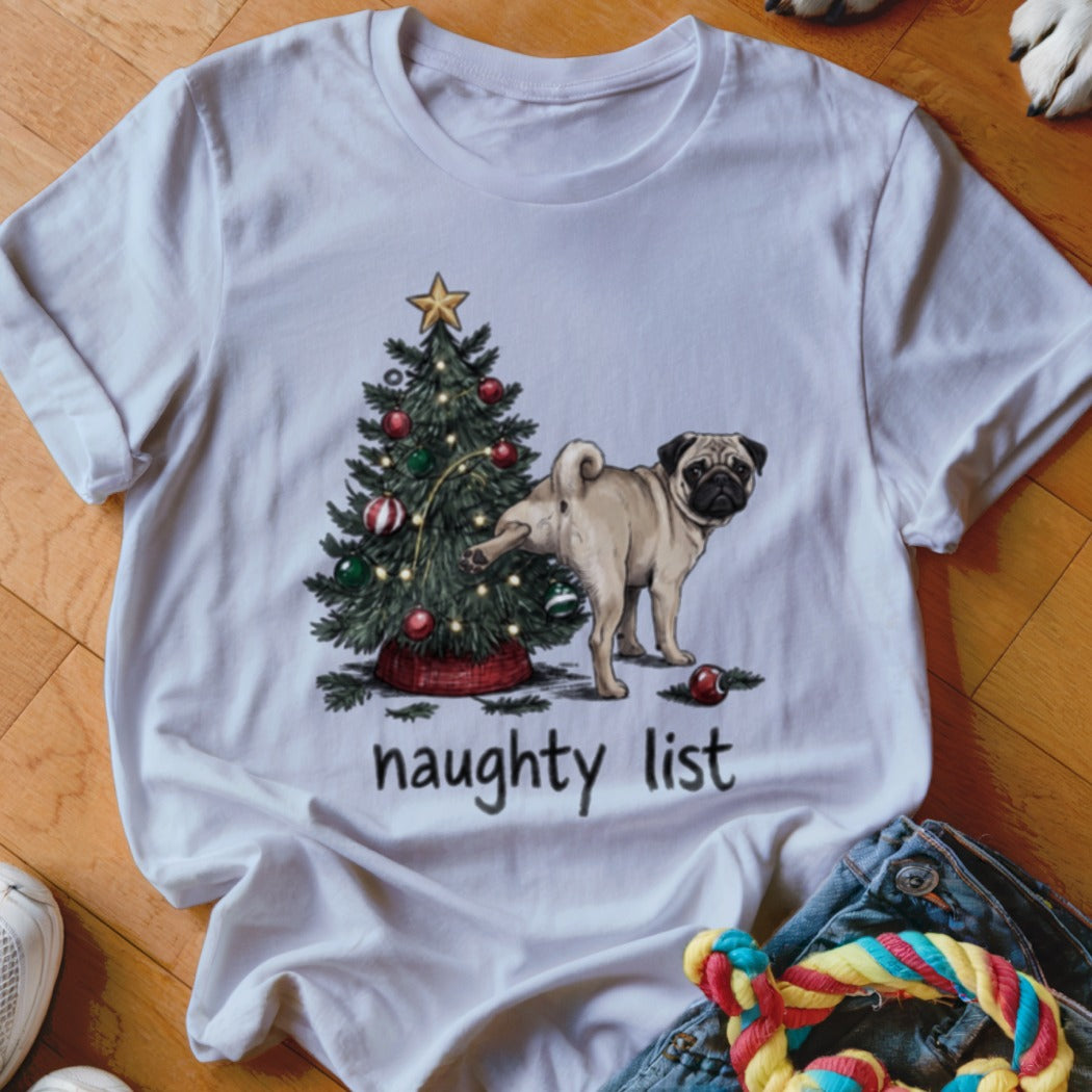 A white t-shirt featuring a graphic of a pug peeing on a Christmas tree with the text "naughty list".