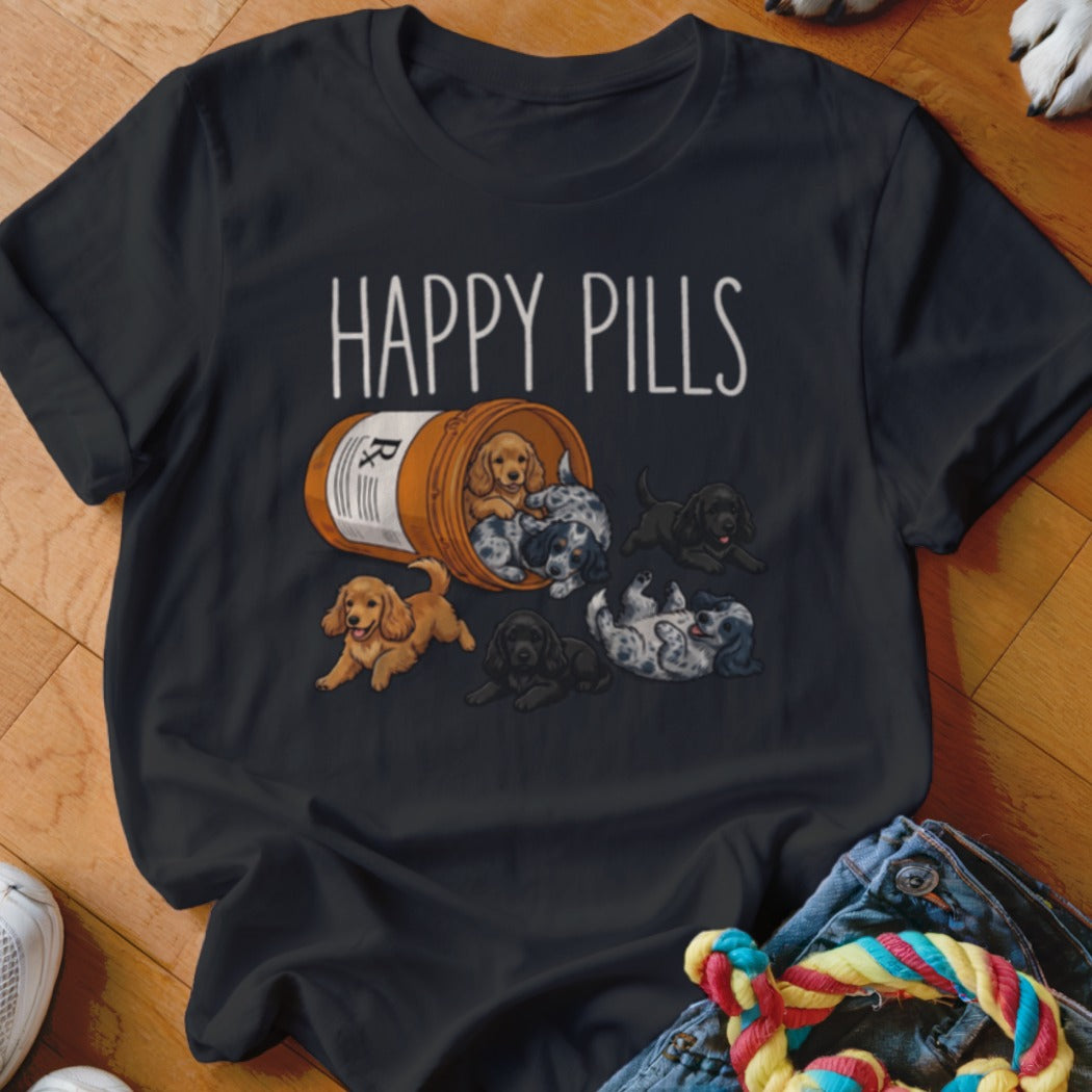 Black t-shirt with "HAPPY PILLS" text and an open prescription bottle spilling out puppies.