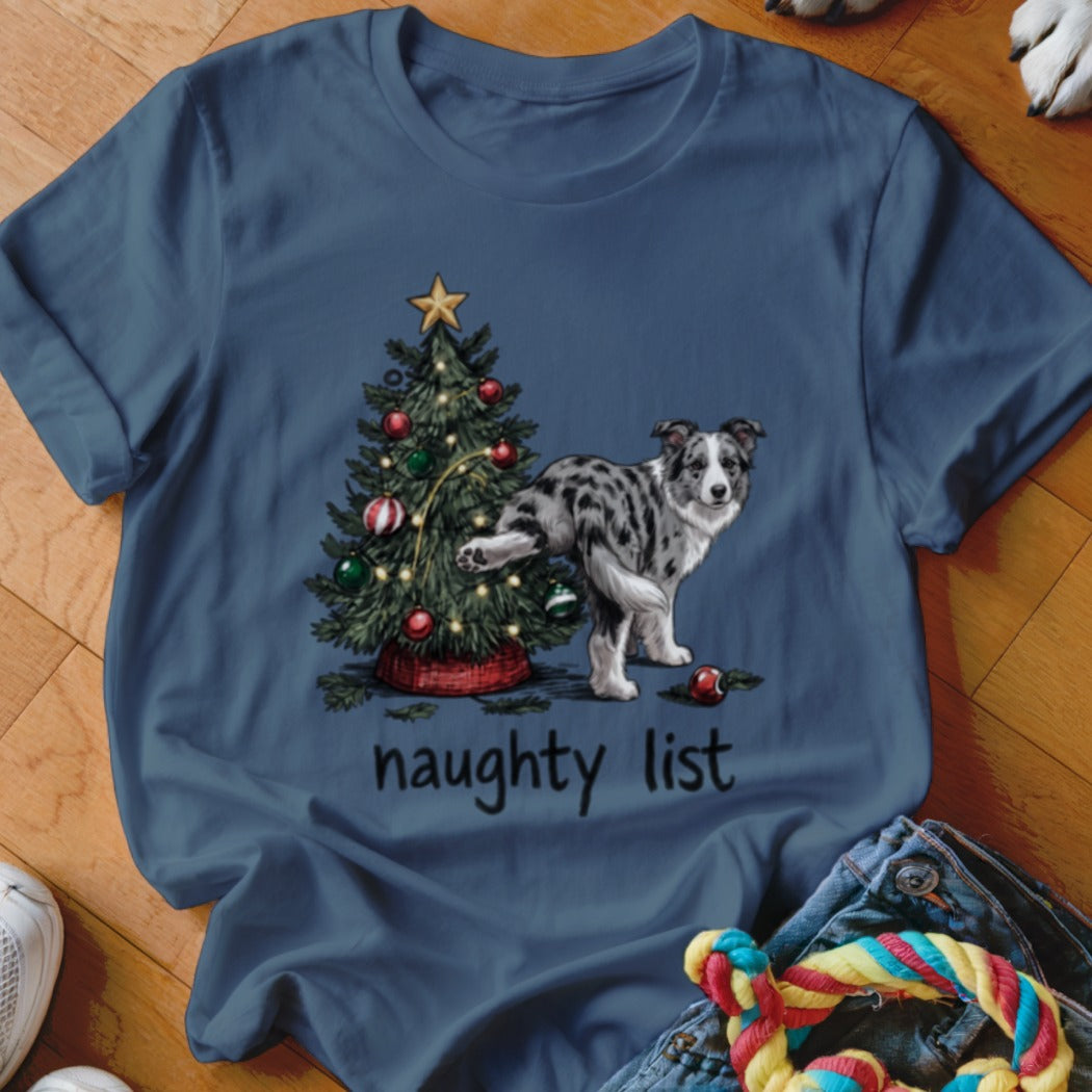 Blue t-shirt with a Christmas tree and a dog lifting its leg, text "naughty list".