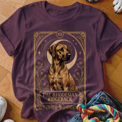 Maroon t-shirt featuring a tarot-style graphic of a Rhodesian Ridgeback, crescent moon, and flowers.