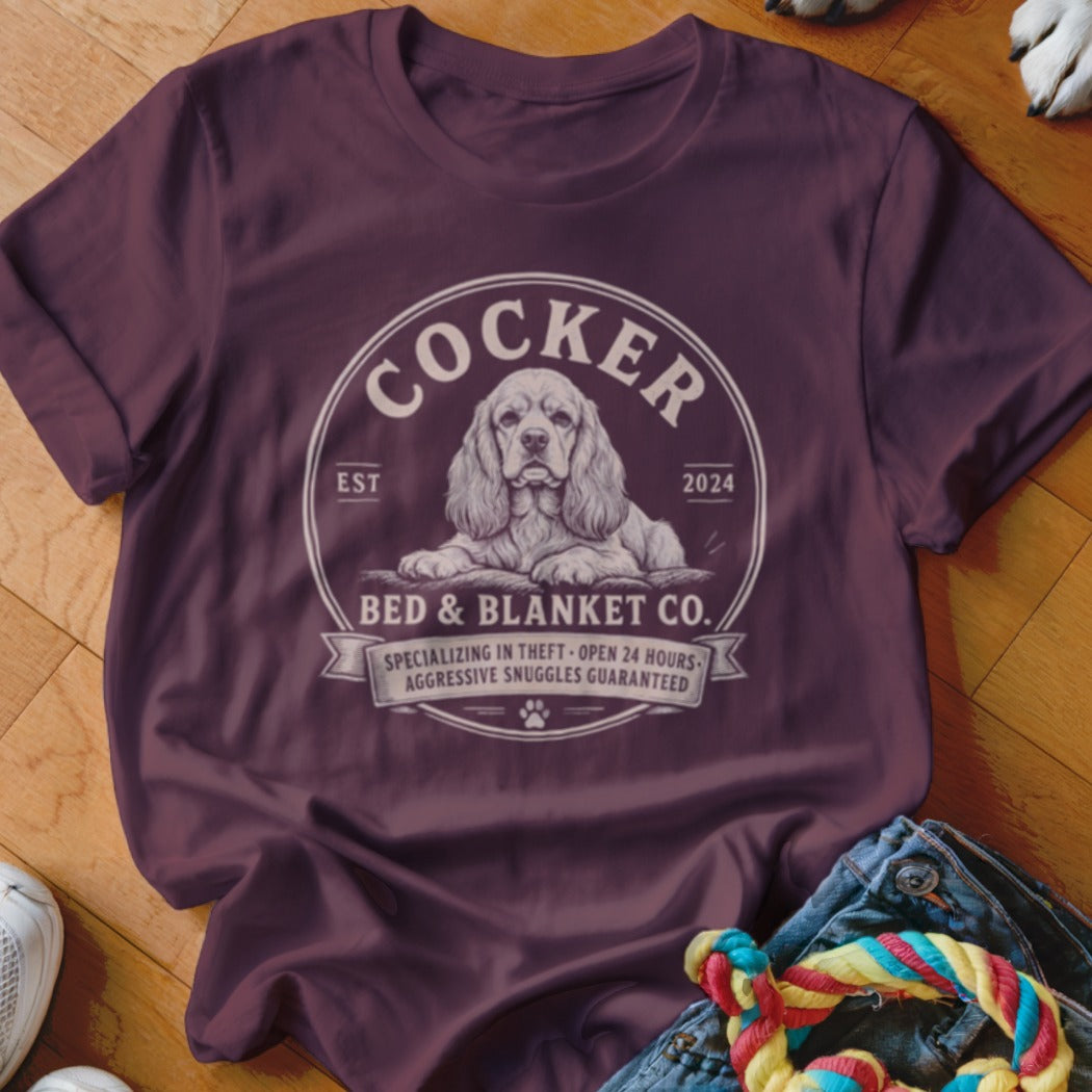 Maroon t-shirt with Cocker Bed & Blanket Co. graphic featuring a cocker spaniel.