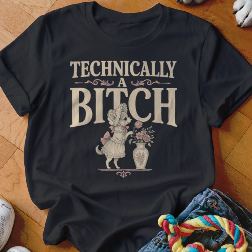 Black t-shirt with "Technically a Bitch" text and a dog in a dress with flowers.