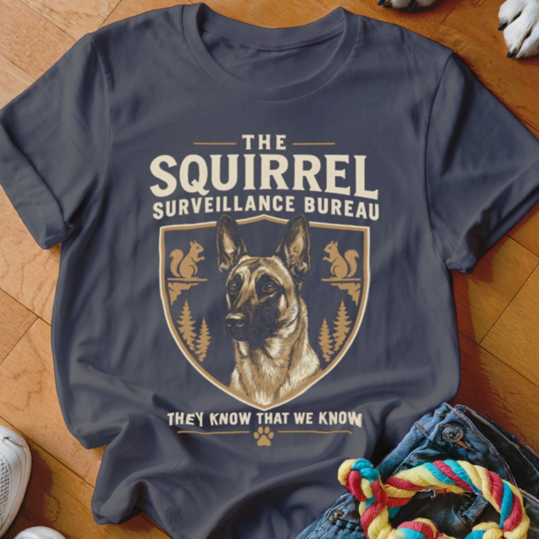 Dark gray t-shirt featuring a graphic with a German Shepherd and text that reads The Squirrel Surveillance Bureau.