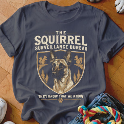 Dark gray t-shirt featuring a graphic with a German Shepherd and text that reads The Squirrel Surveillance Bureau.