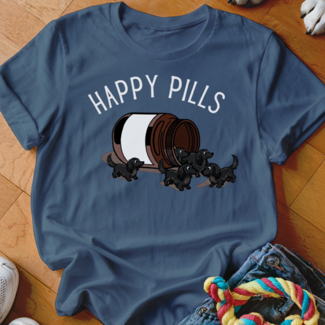 Dark blue t-shirt with "HAPPY PILLS" text and a bottle spilling out little black dogs.