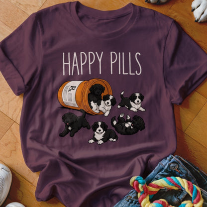 T-shirt with "HAPPY PILLS" text and overturned pill bottle filled with puppies.