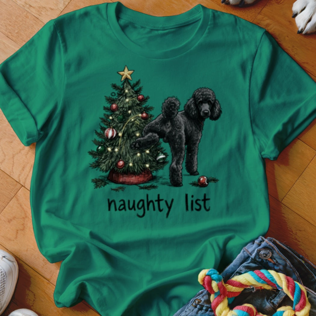 Green t-shirt with a black poodle next to a Christmas tree and the words "naughty list".