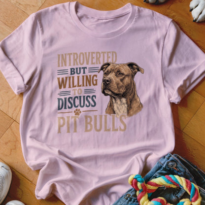 Pink t-shirt with "Introverted but willing to discuss pit bulls" text and pit bull dog illustration.