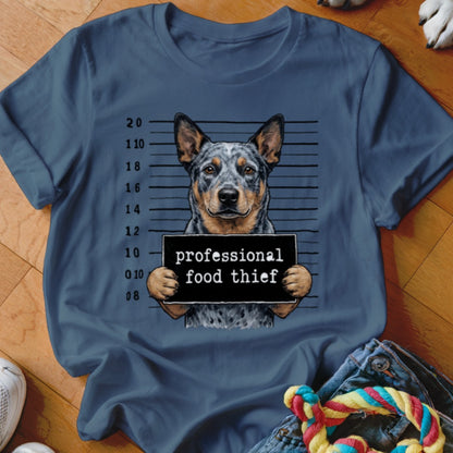 Blue t-shirt with a dog mugshot graphic reading "professional food thief".