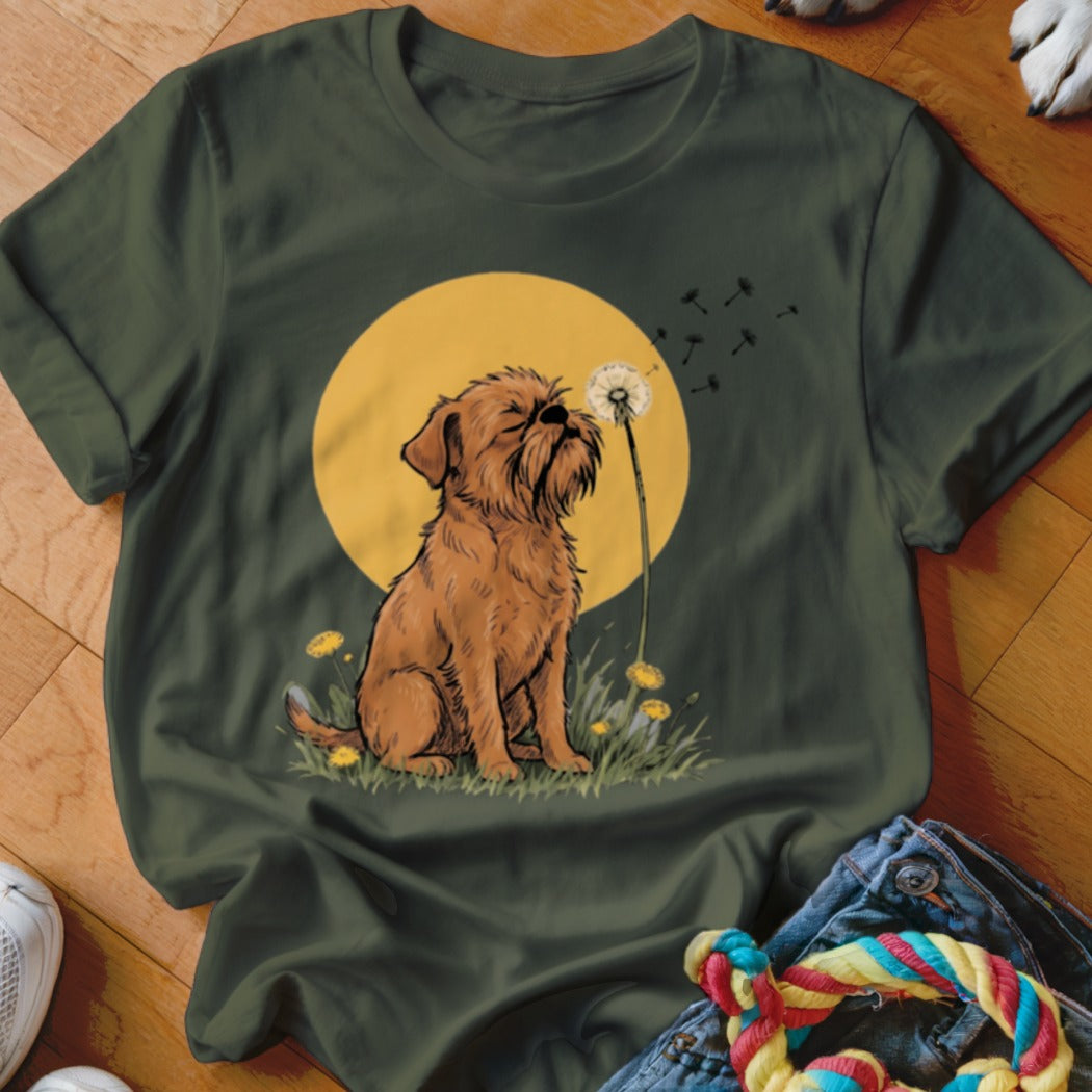 Dark green t-shirt featuring an illustration of a brown dog blowing dandelion seeds against a yellow circle.