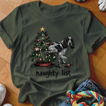 Black and white dog peeing on a Christmas tree with the text "naughty list".