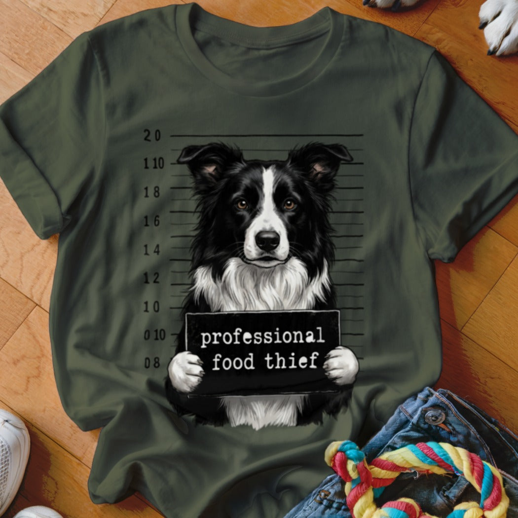 Border collie mugshot graphic with "professional food thief" sign.