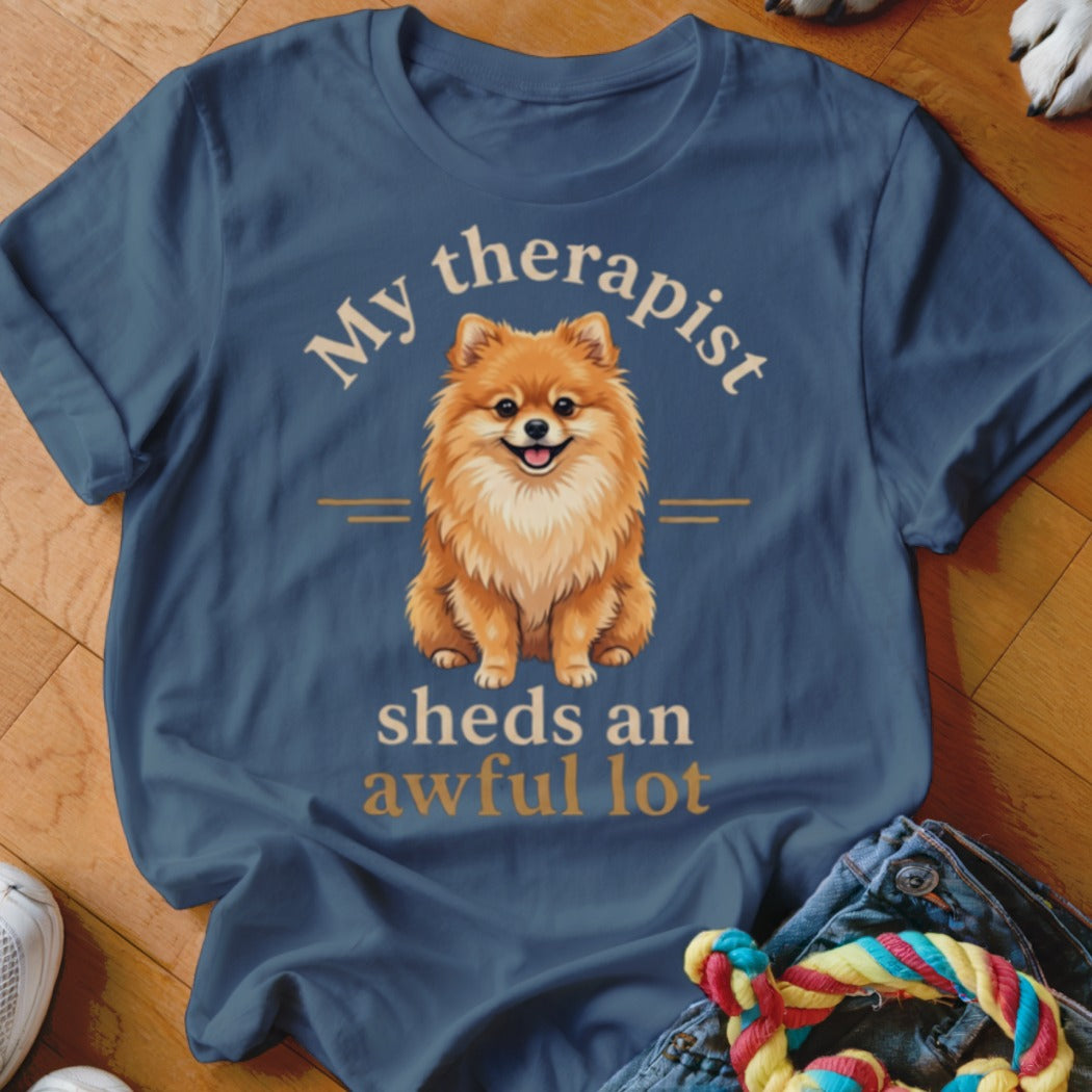 Blue t-shirt with a Pomeranian and text "My therapist sheds an awful lot".