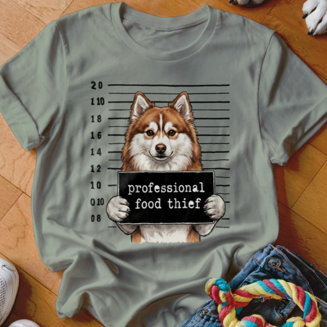 Husky in mugshot holding "professional food thief" sign with height markings.