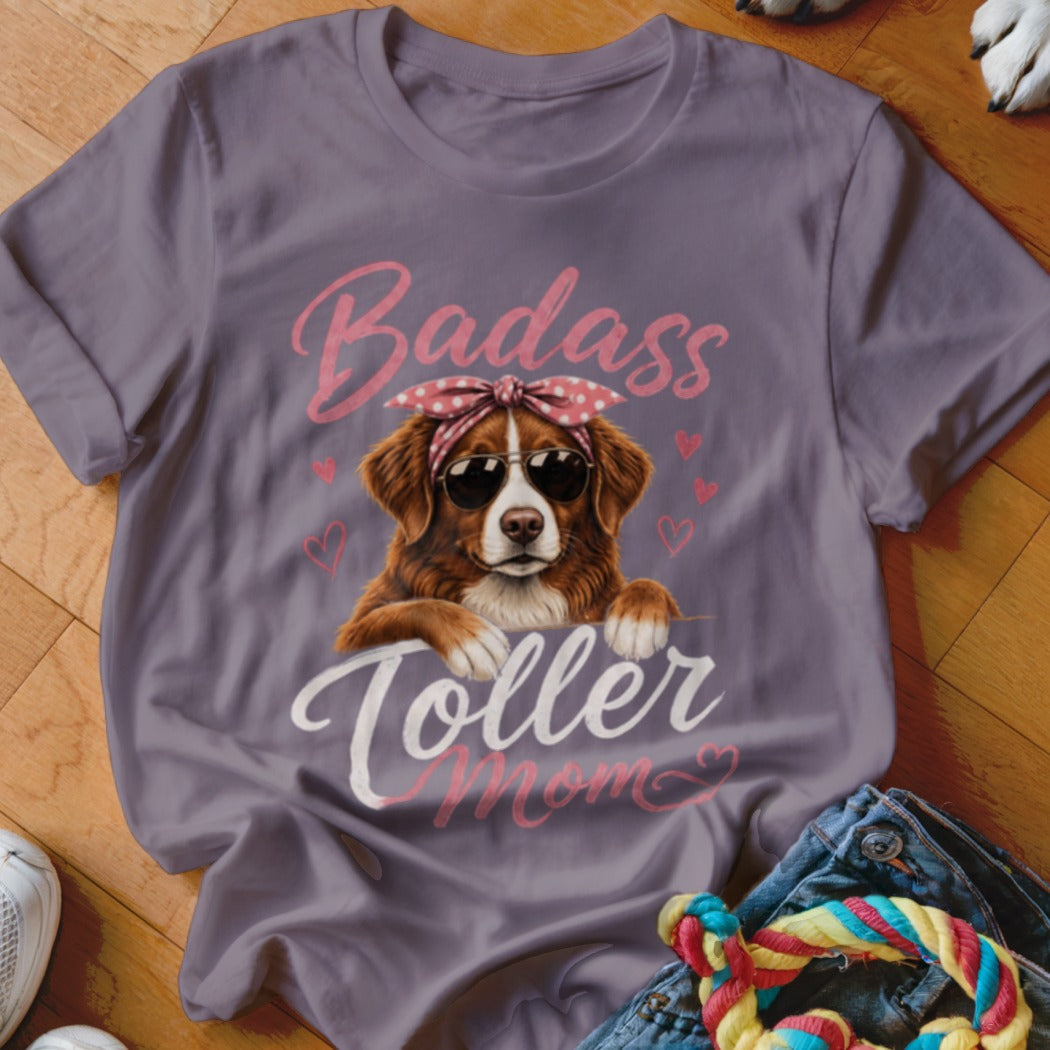 T-shirt with a dog wearing sunglasses and a bandana, reads "Badass Toller Mom".