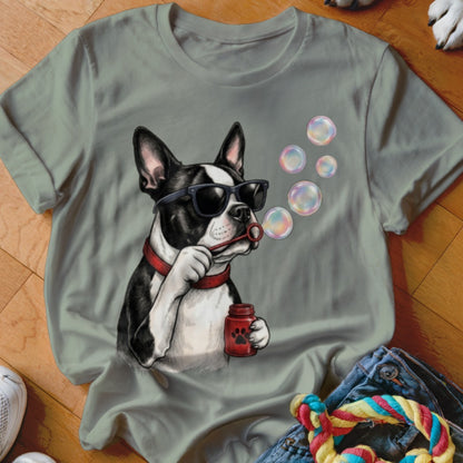 A gray crewneck t-shirt featuring a graphic of a Boston Terrier wearing sunglasses and blowing bubbles.