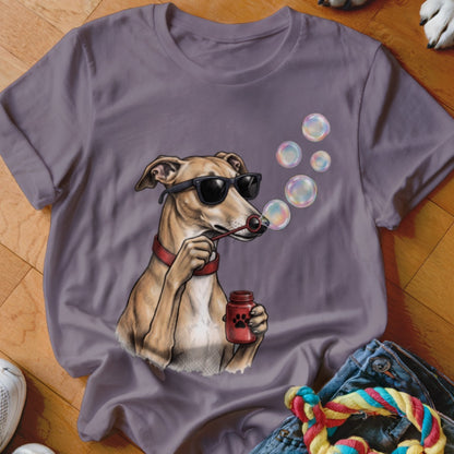A grey crew-neck t-shirt features an illustration of a dog wearing sunglasses blowing bubbles.