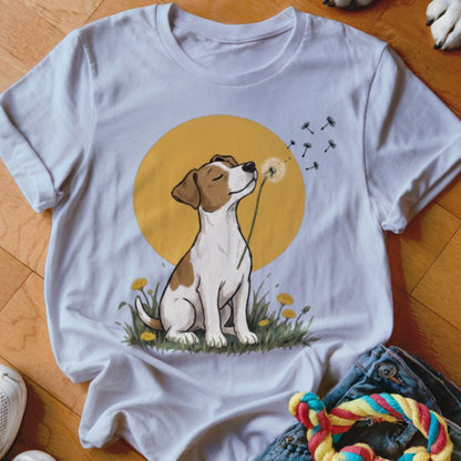 A white t-shirt featuring an illustration of a dog blowing dandelion seeds against a yellow circle.