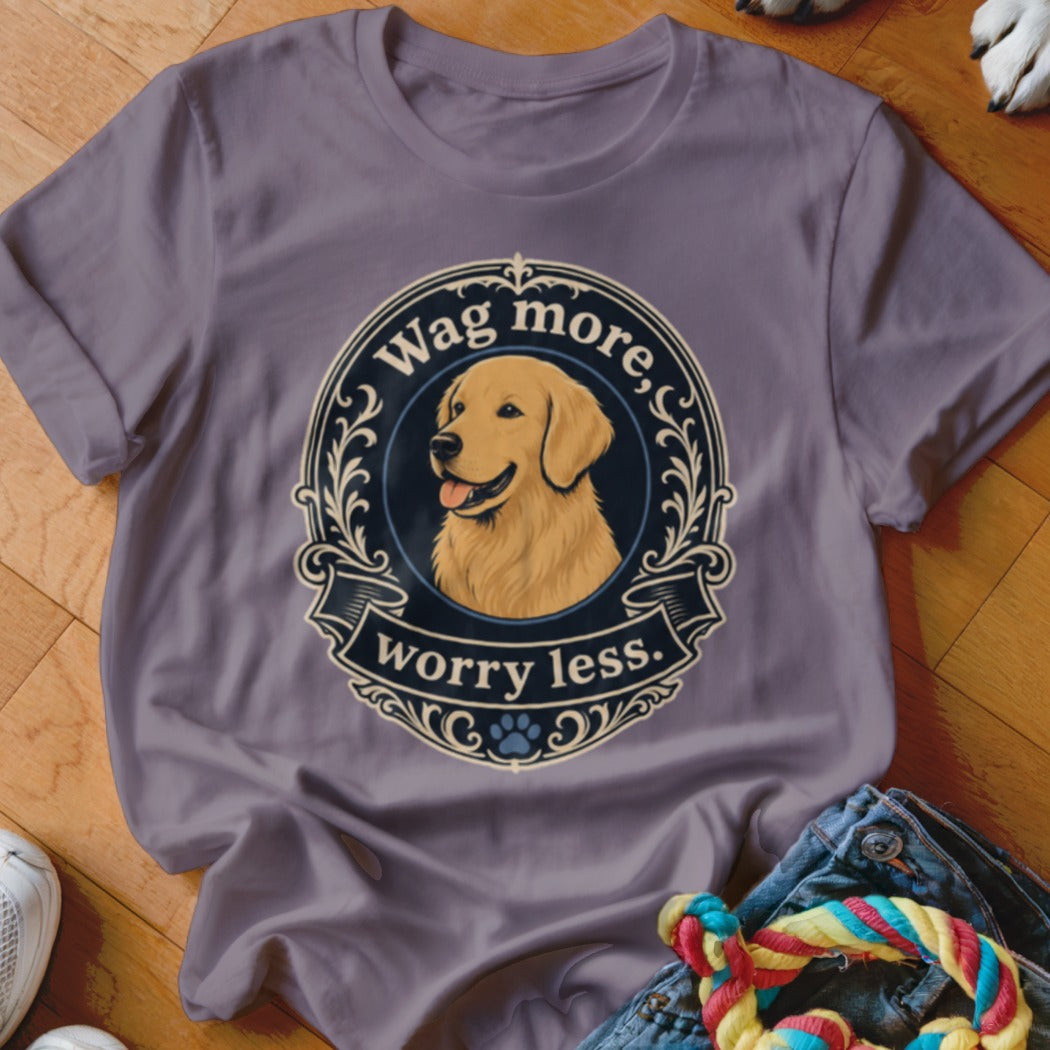 Purple t-shirt featuring a Golden Retriever with text "Wag more, worry less."