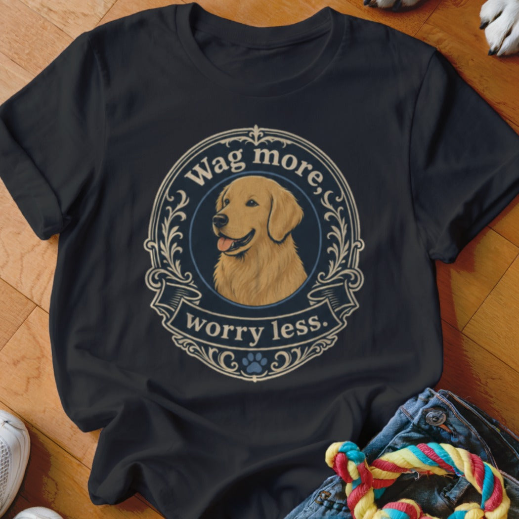 Dark t-shirt with golden retriever portrait and "Wag more, worry less." text.