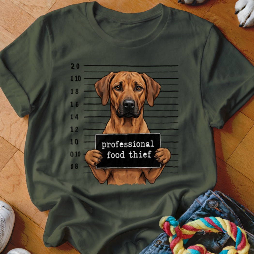 Green t-shirt with a dog mugshot graphic reading "professional food thief."