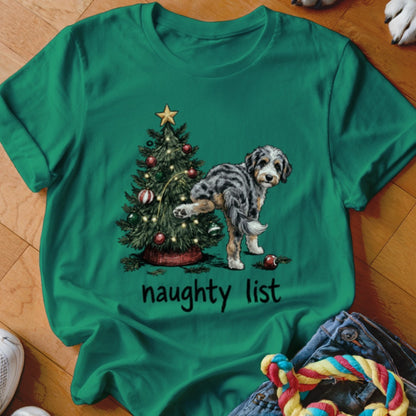 Green t-shirt with a dog, Christmas tree, and "naughty list" text.
