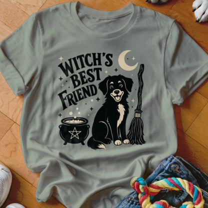 Black and white dog with "Witch's Best Friend" text, cauldron, broom, and moon.