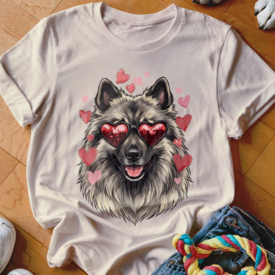 A cream t-shirt with a graphic of a gray dog wearing heart-shaped sunglasses, surrounded by pink hearts.