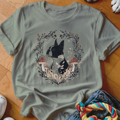 Sage green crewneck t-shirt featuring a graphic of a Boston terrier surrounded by mushrooms and foliage.