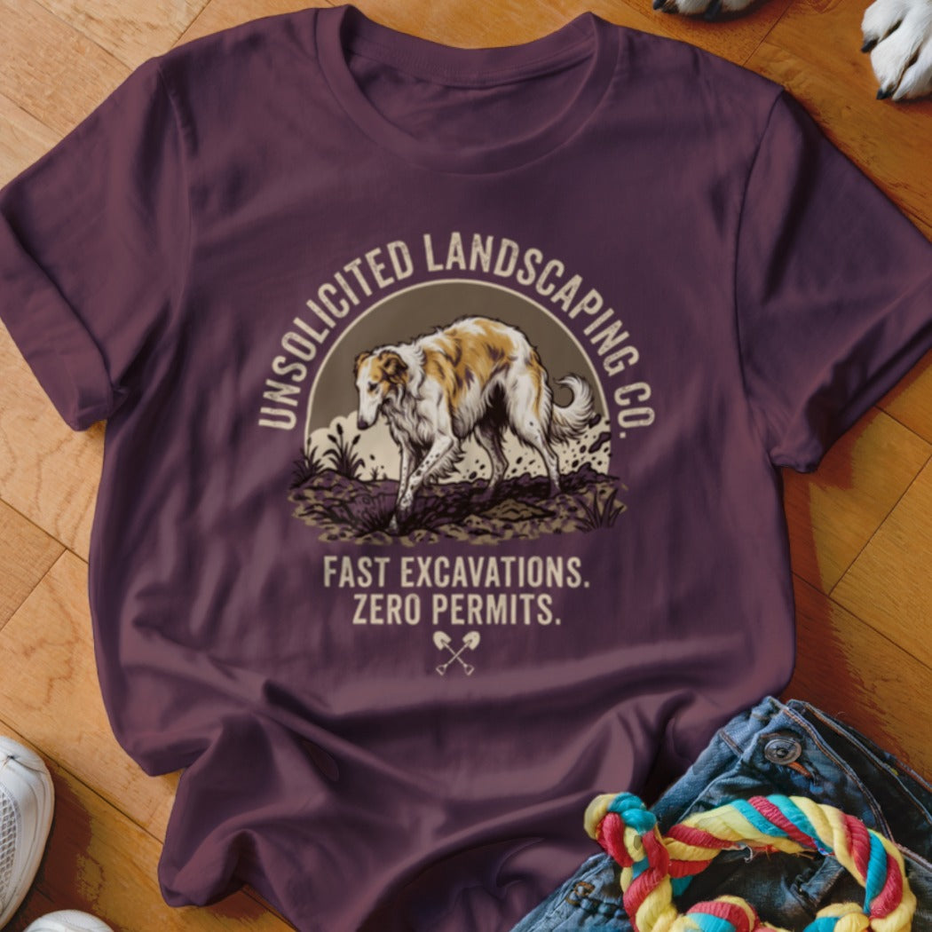Maroon t-shirt with illustration of Borzoi dog and text "Unsolicited Landscaping Co. Fast Excavations. Zero Permits."