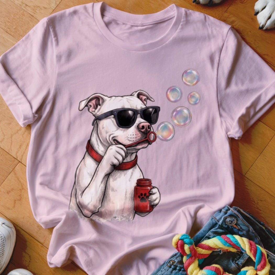 Light pink crewneck t-shirt featuring a graphic of a white pit bull wearing sunglasses and blowing bubbles.
