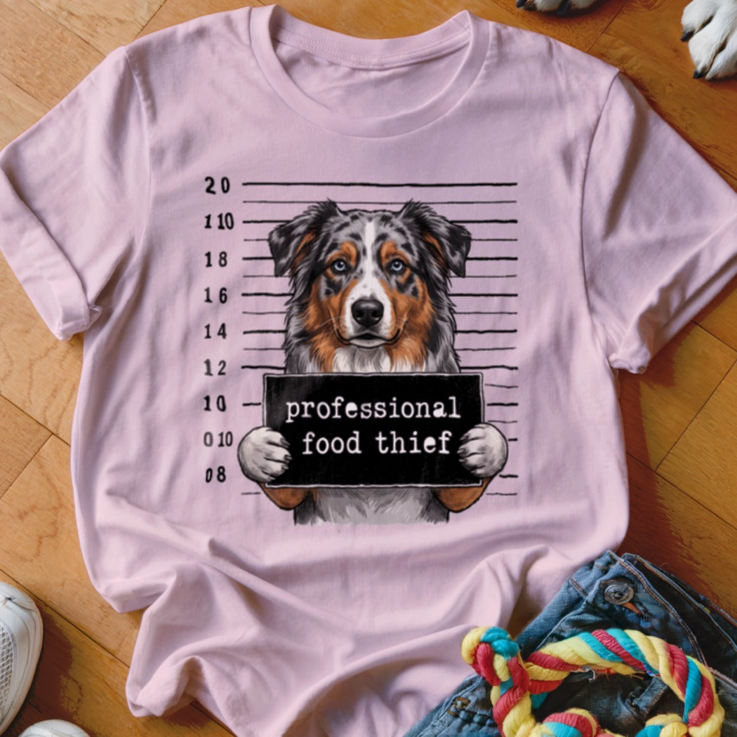 Pink t-shirt with Australian Shepherd mugshot and "professional food thief" sign.
