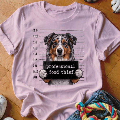 Pink t-shirt with Australian Shepherd mugshot and "professional food thief" sign.