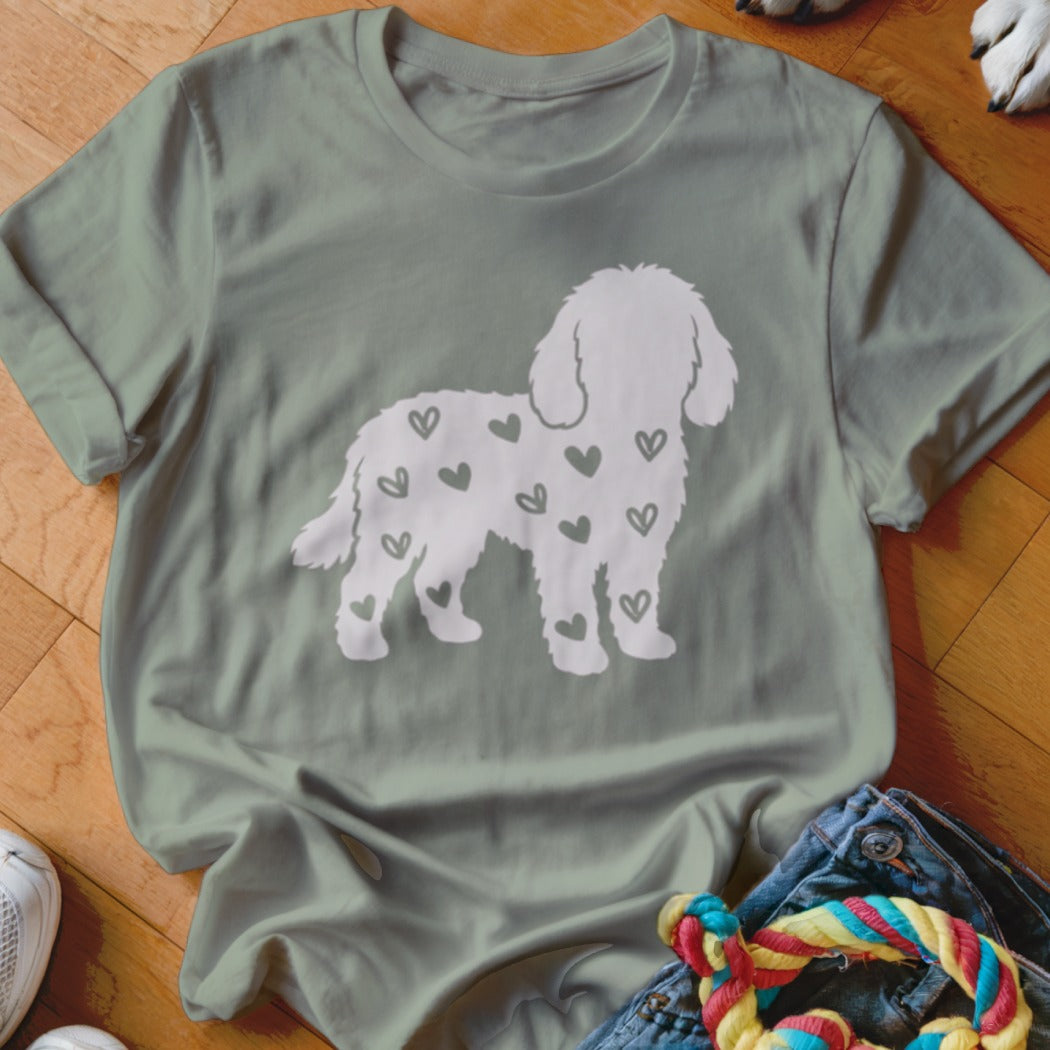 Light grey t-shirt with a white silhouette dog filled with green hearts.
