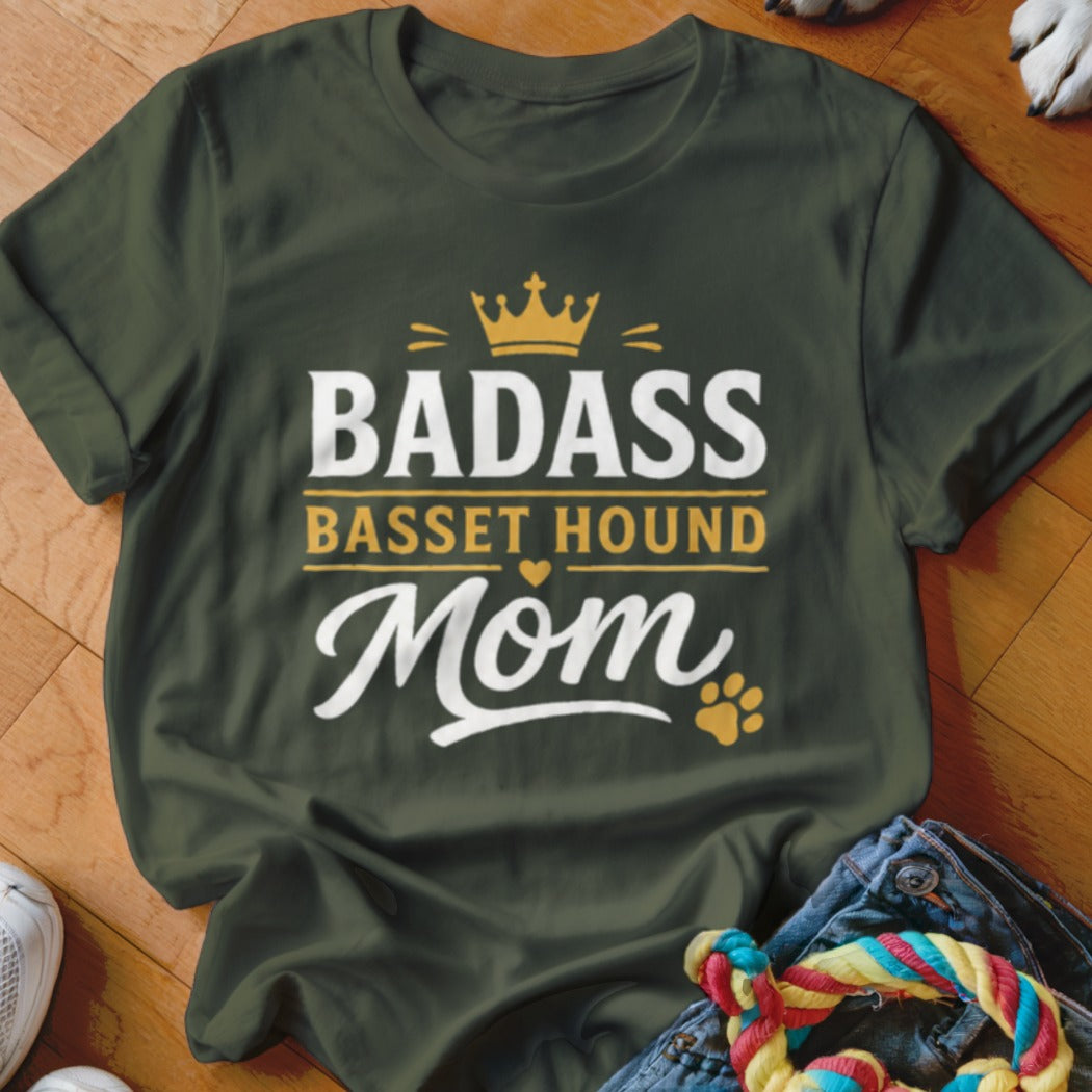 Dark green t-shirt with "Badass Basset Hound Mom" text and a paw print.