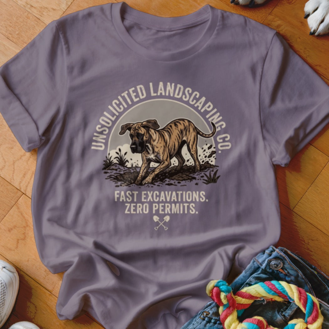 T-shirt with graphic of a dog digging and text "Unsolicited Landscaping Co. Fast Excavations. Zero Permits."