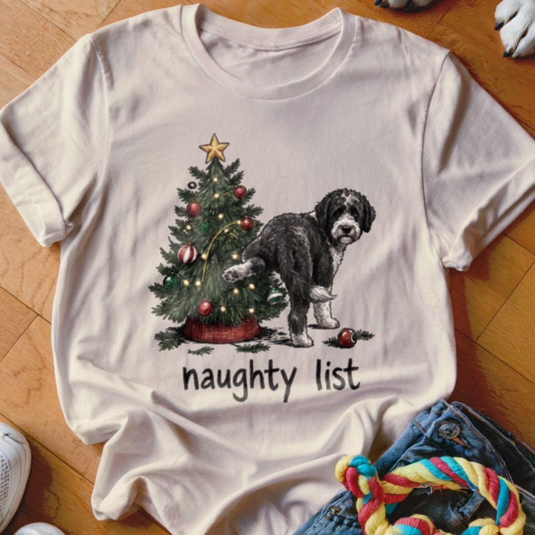 Black and white dog near a Christmas tree, with "naughty list" text.
