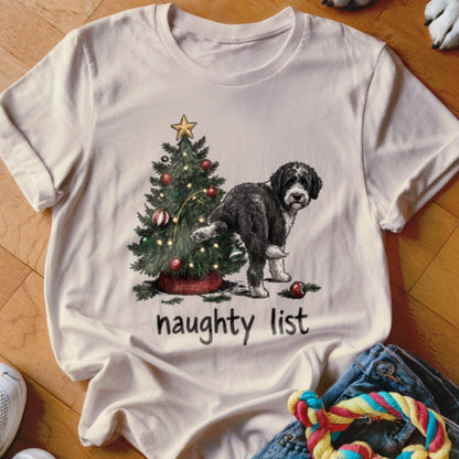 Black and white dog near a Christmas tree, with "naughty list" text.