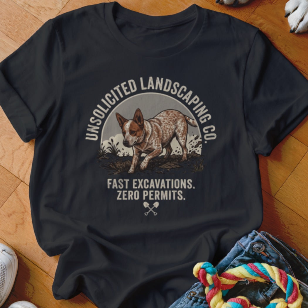 Dark t-shirt with graphic of dog and text "UNSOLICITED LANDSCAPING CO. FAST EXCAVATIONS. ZERO PERMITS."