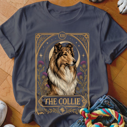 A dark gray t-shirt featuring a tarot card design with a collie dog, a crescent moon, and the text THE COLLIE.