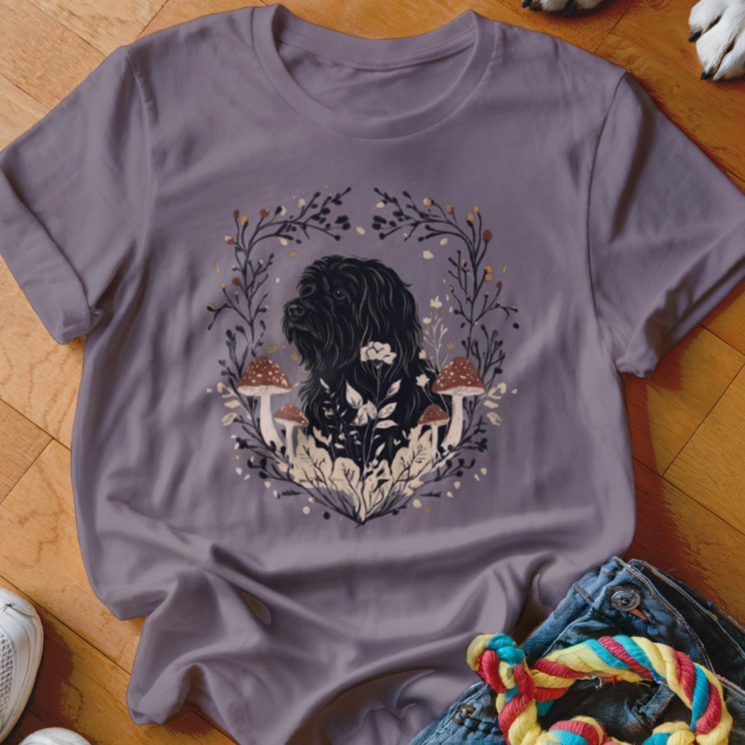 Dusty purple crewneck t-shirt featuring a graphic of a black dog surrounded by botanical illustrations and mushrooms.