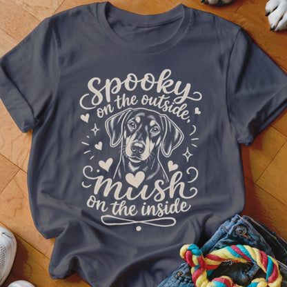Dark t-shirt with a black and tan dog graphic and text reading "Spooky on the outside, mush on the inside".